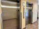 Stainless steel elevators with floor indicators at 3000 Maingate Ln # 209, Kissimmee, FL 34747