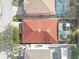 Top-down view of house with red tile roof and pool at 319 Sand Ridge Dr, Davenport, FL 33896