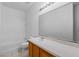 Bathroom with wood vanity and a bathtub at 319 Sand Ridge Dr, Davenport, FL 33896