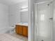 Bathroom with tub, shower, and wood vanity at 319 Sand Ridge Dr, Davenport, FL 33896