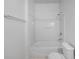 Simple bathroom featuring a shower/tub combo and toilet at 319 Sand Ridge Dr, Davenport, FL 33896