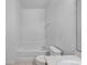 Bathroom with a bathtub and toilet at 319 Sand Ridge Dr, Davenport, FL 33896