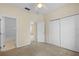 Spacious bedroom with double door closet and neutral colored walls at 319 Sand Ridge Dr, Davenport, FL 33896