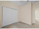 Simple bedroom with double door closet and neutral decor at 319 Sand Ridge Dr, Davenport, FL 33896
