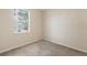 Bright bedroom with neutral walls and carpeted floor at 319 Sand Ridge Dr, Davenport, FL 33896