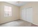 Spacious bedroom with large closet and window with blinds at 319 Sand Ridge Dr, Davenport, FL 33896