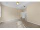 Spacious bedroom with ceiling fan and carpet at 319 Sand Ridge Dr, Davenport, FL 33896