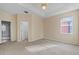 Bedroom with large window and ceiling fan at 319 Sand Ridge Dr, Davenport, FL 33896