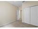 Bright bedroom with double door closet and neutral walls at 319 Sand Ridge Dr, Davenport, FL 33896