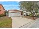 Cute one-story home with attached garage and landscaping at 319 Sand Ridge Dr, Davenport, FL 33896