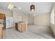 Kitchen with breakfast bar and access to living room at 319 Sand Ridge Dr, Davenport, FL 33896