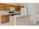 Kitchen with light wood cabinets and appliances at 319 Sand Ridge Dr, Davenport, FL 33896