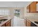 Kitchen with view of pool and sliding doors to backyard at 319 Sand Ridge Dr, Davenport, FL 33896