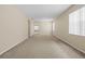 Spacious living room with neutral carpeting at 319 Sand Ridge Dr, Davenport, FL 33896