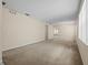 Spacious living room with neutral carpeting at 319 Sand Ridge Dr, Davenport, FL 33896