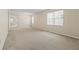 Spacious living room with neutral carpeting at 319 Sand Ridge Dr, Davenport, FL 33896