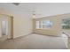 Bright living room with neutral carpeting and sliding glass doors at 319 Sand Ridge Dr, Davenport, FL 33896