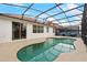 Serene kidney-shaped pool with screened enclosure at 319 Sand Ridge Dr, Davenport, FL 33896