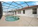 Relaxing kidney-shaped pool with screened enclosure at 319 Sand Ridge Dr, Davenport, FL 33896