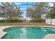 Refreshing pool with screened enclosure and backyard view at 319 Sand Ridge Dr, Davenport, FL 33896