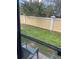 Private backyard with grassy area and a wall at 3459 Allegra Cir, St Cloud, FL 34772