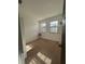 Bright bedroom with carpet flooring and two windows at 3459 Allegra Cir, St Cloud, FL 34772