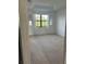 Bright bedroom with large window and carpeted floor at 3459 Allegra Cir, St Cloud, FL 34772