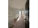 Upstairs hallway with carpet, doors to bedrooms, and a staircase at 3459 Allegra Cir, St Cloud, FL 34772