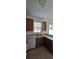 Kitchen with wood cabinets, tile floors and stainless steel appliances at 3459 Allegra Cir, St Cloud, FL 34772