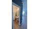 Small powder room with pedestal sink and accent wall at 3459 Allegra Cir, St Cloud, FL 34772