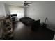 Neutral bedroom features wood-look flooring and ceiling fan at 4575 S Texas Ave # 207, Orlando, FL 32839