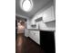 Stylish kitchen featuring white cabinets, granite countertops, stainless steel appliances, and subway tile backsplash at 4575 S Texas Ave # 207, Orlando, FL 32839