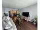 Cozy living room with modern furniture, open layout, and seamlessly connects to the dining area at 4575 S Texas Ave # 207, Orlando, FL 32839