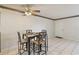 Small dining area with glass-top table and four chairs at 46 W Marbrisa Way, Kissimmee, FL 34743