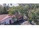 Cozy single-story villa with red trim, mature landscaping, and designated parking at 46 W Marbrisa Way, Kissimmee, FL 34743