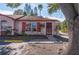 Charming single-story home featuring red trim, shutters, and well-maintained landscaping at 46 W Marbrisa Way, Kissimmee, FL 34743