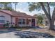 Condo with red roof and a small, well-maintained yard at 46 W Marbrisa Way, Kissimmee, FL 34743