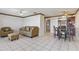 Bright living room with tiled floors, sofa, chair, and ottoman at 46 W Marbrisa Way, Kissimmee, FL 34743
