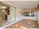 Sunroom with kitchen access and tile floors at 46 W Marbrisa Way, Kissimmee, FL 34743