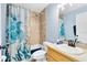 Bathroom with a shower/tub combo, and sea-themed decor at 4755 Oakwood Dr, St Cloud, FL 34772