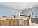Kitchen with island, double sink, and stainless steel appliances at 4755 Oakwood Dr, St Cloud, FL 34772