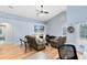 Living room with hardwood floors, comfortable seating, and backyard access at 4755 Oakwood Dr, St Cloud, FL 34772