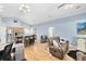 Open concept living area with hardwood floors and kitchen views at 4755 Oakwood Dr, St Cloud, FL 34772