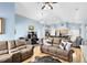 Open concept living room and kitchen with hardwood floors at 4755 Oakwood Dr, St Cloud, FL 34772