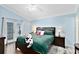 Main bedroom with king-size bed, and access to backyard at 4755 Oakwood Dr, St Cloud, FL 34772