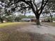 Spacious backyard with large oak tree and pool at 5030 Haywood Ruffin Rd, St Cloud, FL 34771