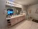 Double vanity bathroom with glass block shower enclosure at 5030 Haywood Ruffin Rd, St Cloud, FL 34771