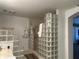 Spacious bathroom with glass block accents and a walk-in shower at 5030 Haywood Ruffin Rd, St Cloud, FL 34771