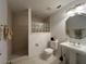 Bathroom with shower, toilet, and pedestal sink at 5030 Haywood Ruffin Rd, St Cloud, FL 34771