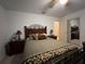 Bedroom with a queen bed and ensuite bathroom access at 5030 Haywood Ruffin Rd, St Cloud, FL 34771
